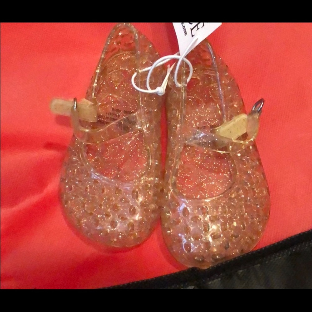 Never worn glitter gold jelly size 4